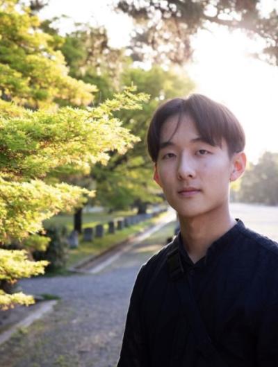 student near trees