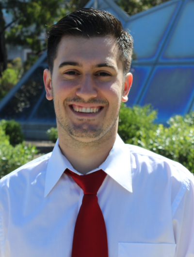 smiling student in tie